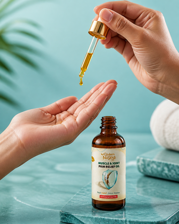 Hands applying massage oil